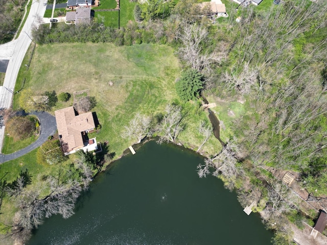 aerial view of property and surrounding area with a large body of water