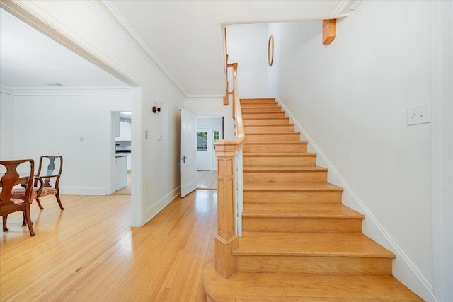 408 W Iowa St, Urbana, IL 61801 - staircase featuring wood finished floors, crown molding, and baseboards