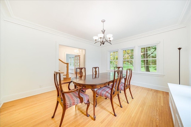 408 W Iowa St, Urbana, IL 61801 - dining space featuring a chandelier, light wood-style floors, ornamental molding, and baseboards