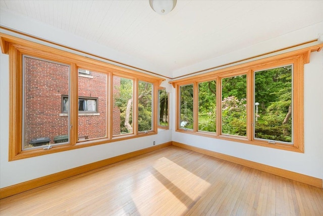 408 W Iowa St, Urbana, IL 61801 - unfurnished sunroom featuring baseboards and hardwood / wood-style flooring