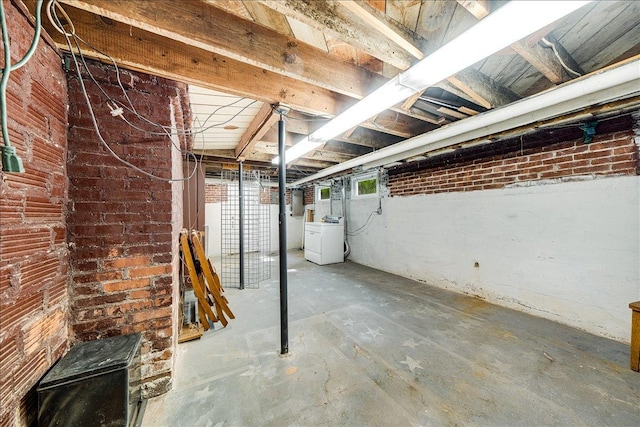 408 W Iowa St, Urbana, IL 61801 - below grade area with washer / dryer, brick wall, and electric panel