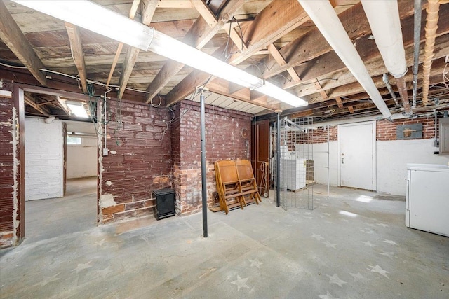 408 W Iowa St, Urbana, IL 61801 - below grade area featuring washer / clothes dryer and brick wall