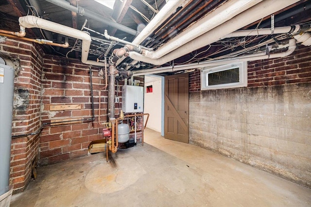 408 W Iowa St, Urbana, IL 61801 - unfinished basement featuring brick wall, tankless water heater, and water heater