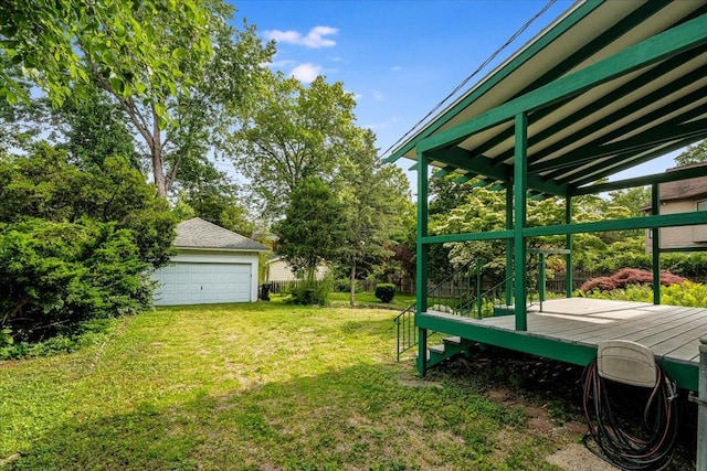408 W Iowa St, Urbana, IL 61801 - view of green lawn featuring a garage, a wooden deck, and an outdoor structure