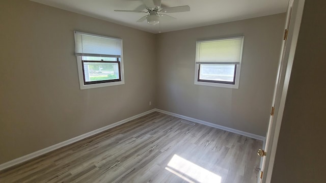 107 Georgine St, Crystal Lake, IL 60014 - empty room featuring plenty of natural light, wood finished floors, baseboards, and ceiling fan