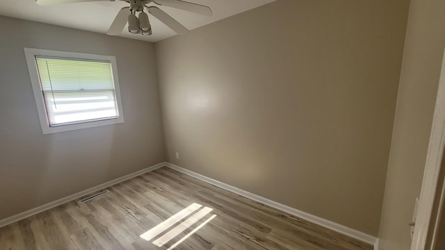 107 Georgine St, Crystal Lake, IL 60014 - empty room featuring baseboards, light wood-style floors, and a ceiling fan
