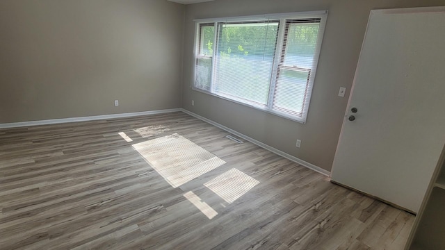 107 Georgine St, Crystal Lake, IL 60014 - unfurnished room with light wood-style flooring and baseboards