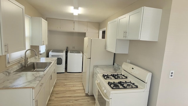 107 Georgine St, Crystal Lake, IL 60014 - kitchen with independent washer and dryer, a sink, white gas range, light wood finished floors, and white cabinets