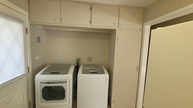 107 Georgine St, Crystal Lake, IL 60014 - laundry room with washing machine and clothes dryer and cabinet space