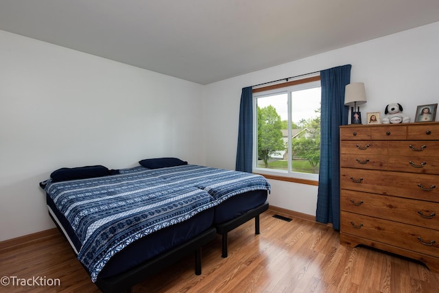 543 White Birch Rd, Lindenhurst, IL 60046 - bedroom featuring light wood-style flooring and baseboards
