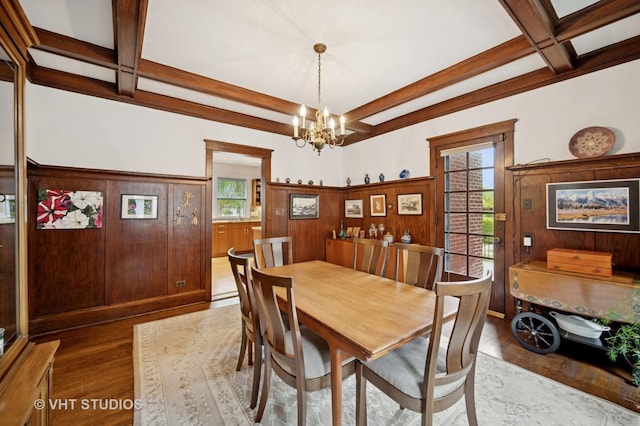 1431 Noyes St, Evanston, IL 60201 - dining area featuring coffered ceiling, wood finished floors, a chandelier, beamed ceiling, and wainscoting