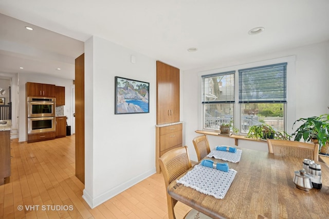 1431 Noyes St, Evanston, IL 60201 - dining space featuring light wood finished floors, baseboards, and recessed lighting