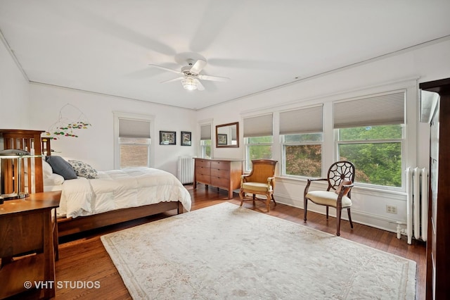 1431 Noyes St, Evanston, IL 60201 - bedroom with radiator, wood finished floors, baseboards, and a ceiling fan