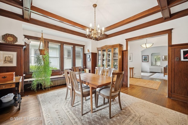 1431 Noyes St, Evanston, IL 60201 - dining room featuring radiator, beamed ceiling, hardwood / wood-style flooring, a chandelier, and arched walkways