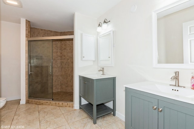 30W012 Laurel Ct, Warrenville, IL 60555 - bathroom with a shower stall, two vanities, toilet, and baseboards