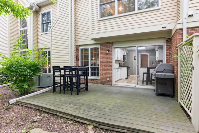 30W012 Laurel Ct, Warrenville, IL 60555 - wooden deck with area for grilling, central AC unit, and outdoor dining space
