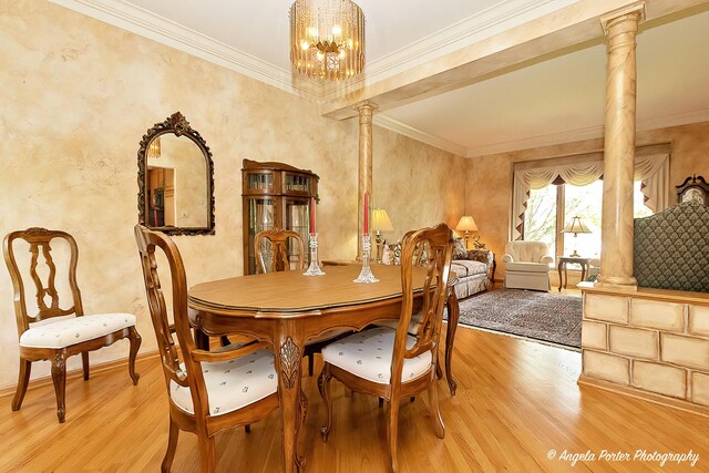8720 Galleria Ct, Spring Grove, IL 60081 - dining room featuring ornate columns, light wood-style floors, crown molding, a chandelier, and baseboards