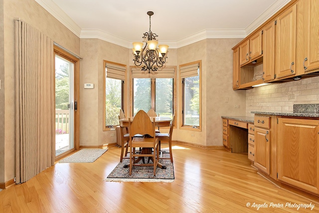 8720 Galleria Ct, Spring Grove, IL 60081 - dining area with a chandelier, light wood-type flooring, baseboards, and ornamental molding
