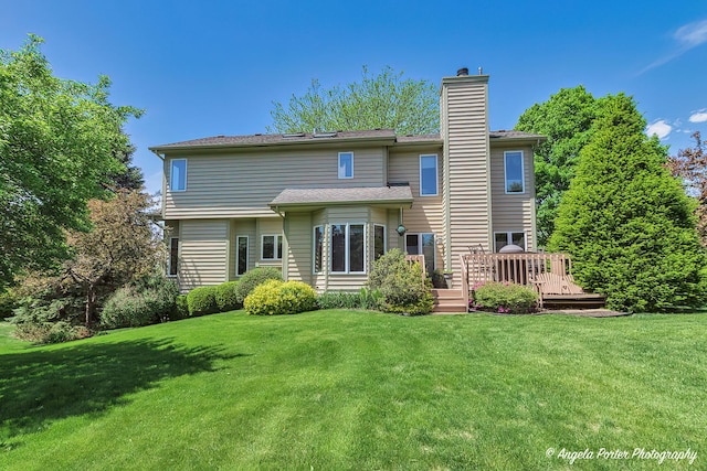 8720 Galleria Ct, Spring Grove, IL 60081 - back of house featuring a chimney, a yard, and a wooden deck