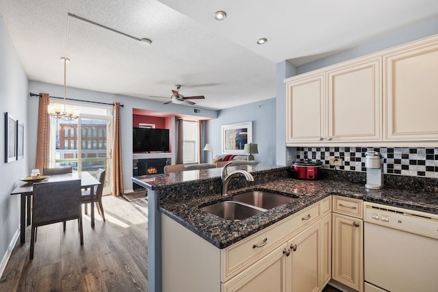 400 Village Cir Unit 207, Willow Springs, IL 60480 - kitchen with dishwasher, cream cabinetry, a sink, a ceiling fan, and light wood finished floors