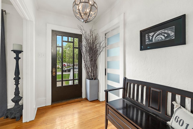 409 Cottage Ave, Glen Ellyn, IL 60137 - entryway featuring crown molding, a chandelier, and light wood finished floors