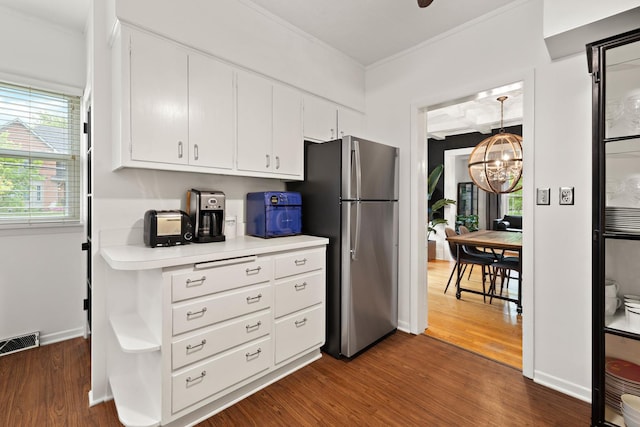 409 Cottage Ave, Glen Ellyn, IL 60137 - kitchen with freestanding refrigerator, crown molding, light countertops, white cabinets, and dark wood finished floors