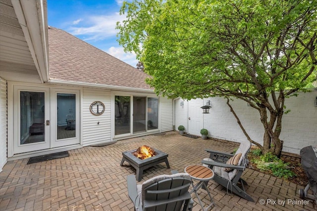 7 Hampton On Auburn Dr, Rolling Meadows, IL 60008 - view of patio featuring french doors and a fire pit