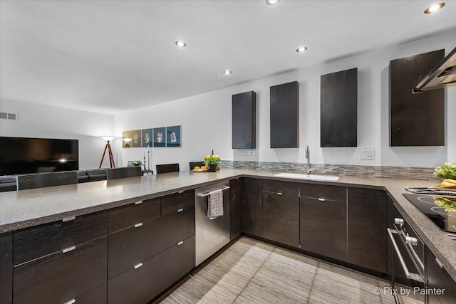 7 Hampton On Auburn Dr, Rolling Meadows, IL 60008 - kitchen with a sink, stainless steel appliances, dark brown cabinets, open floor plan, and recessed lighting