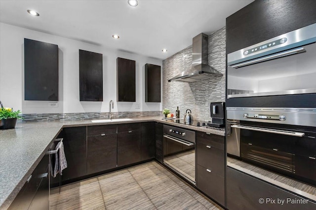 7 Hampton On Auburn Dr, Rolling Meadows, IL 60008 - kitchen with wall chimney range hood, a sink, black electric stovetop, tasteful backsplash, and double oven