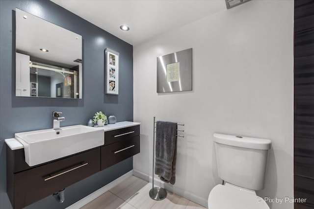 7 Hampton On Auburn Dr, Rolling Meadows, IL 60008 - bathroom featuring vanity, toilet, baseboards, and recessed lighting