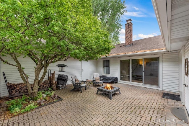 7 Hampton On Auburn Dr, Rolling Meadows, IL 60008 - view of patio with an outdoor fire pit