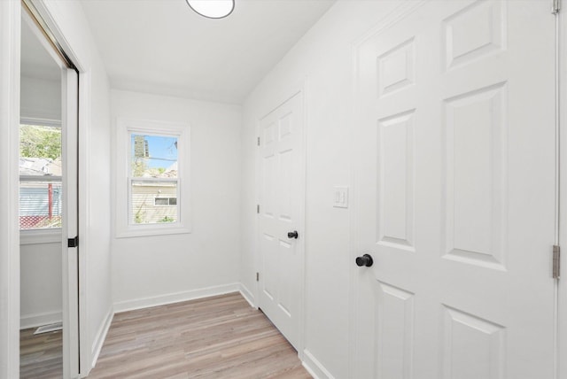 2519 N New England Ave, Chicago, IL 60707 - hallway with light wood-type flooring and baseboards