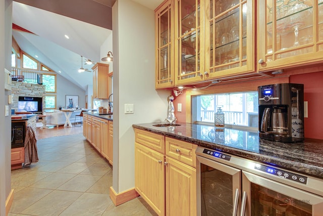 25909 W Sunset Rd, Barrington, IL 60010 - kitchen with wine cooler, open floor plan, glass insert cabinets, ceiling fan, and dark stone counters