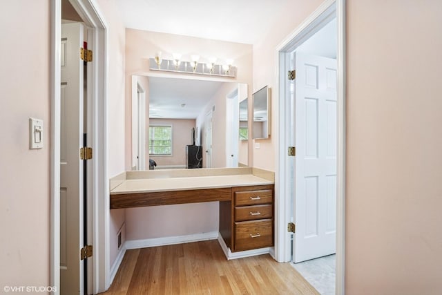 846 Dunhill Dr, Buffalo Grove, IL 60089 - bathroom with wood finished floors, vanity, and baseboards
