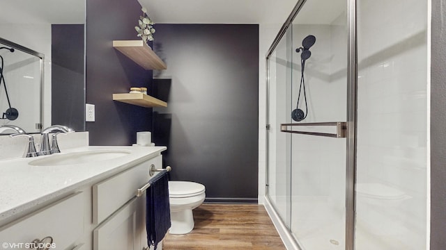 8506 Redbud Ct, Wonder Lake, IL 60097 - bathroom featuring toilet, a shower stall, vanity, and wood finished floors