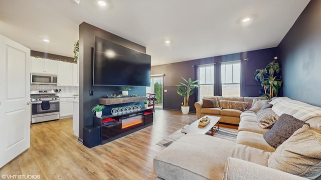 8506 Redbud Ct, Wonder Lake, IL 60097 - living area with light wood-style flooring and recessed lighting