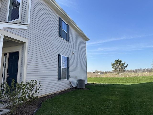 8506 Redbud Ct, Wonder Lake, IL 60097 - view of side of home with a lawn and central AC unit