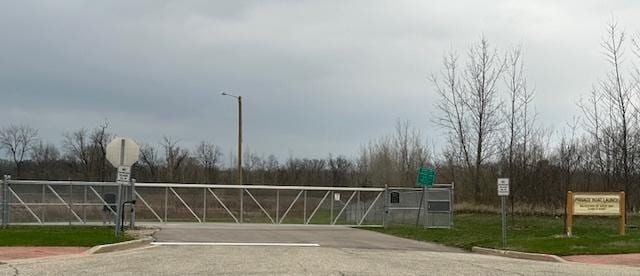 8506 Redbud Ct, Wonder Lake, IL 60097 - view of asphalt road featuring traffic signs and street lights
