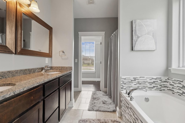 49 W Crabapple Ave, Cortland, IL 60112 - full bathroom featuring double vanity, a garden tub, tile patterned flooring, and baseboards