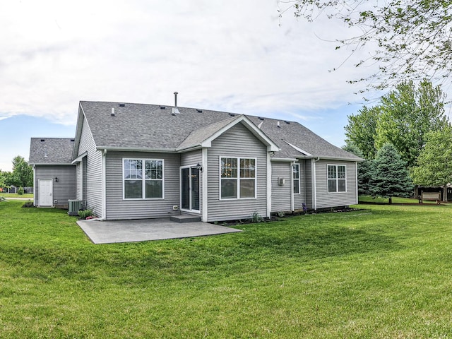 49 W Crabapple Ave, Cortland, IL 60112 - back of property featuring roof with shingles, a patio, a yard, and central AC unit