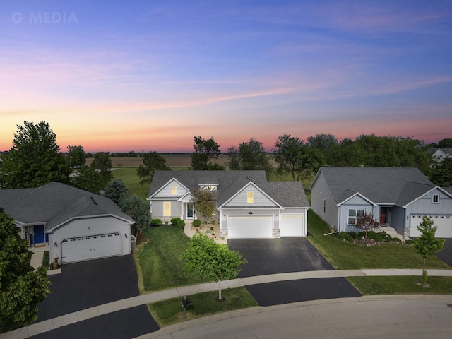 49 W Crabapple Ave, Cortland, IL 60112 - view of front of home featuring driveway, a front lawn, a garage, and a residential view
