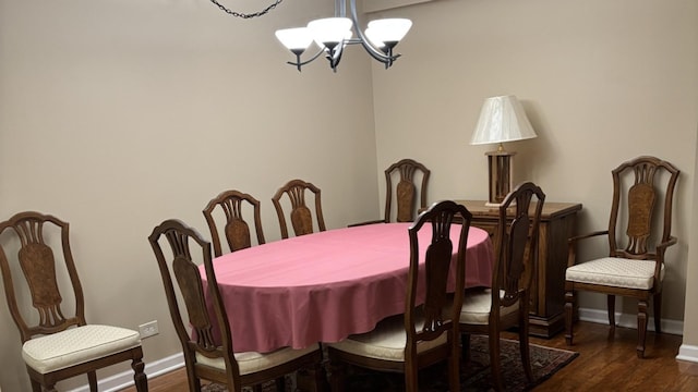 828 Graceland Ave Unit 206, Des Plaines, IL 60016 - dining room featuring a chandelier, dark wood-type flooring, and baseboards