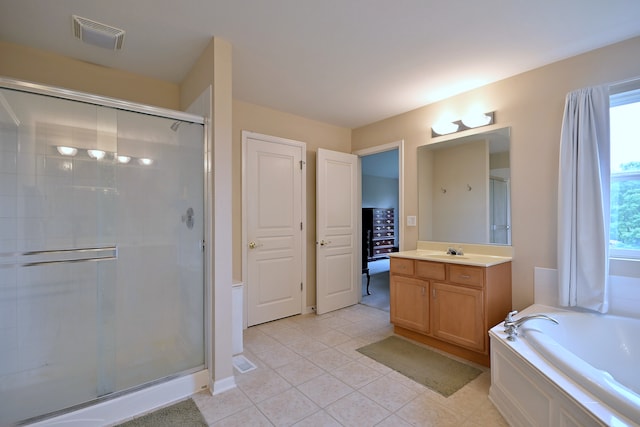 24316 W Bristol Ave, Plainfield, IL 60585 - full bathroom with a shower stall, tile patterned floors, vanity, and a bath