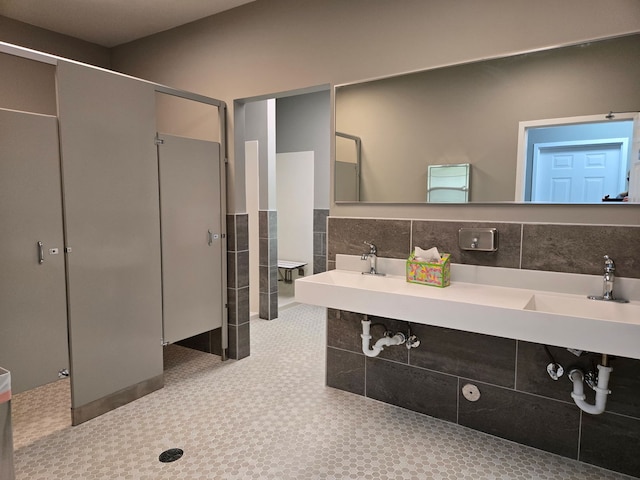24316 W Bristol Ave, Plainfield, IL 60585 - full bath featuring a shower, tile walls, and a sink
