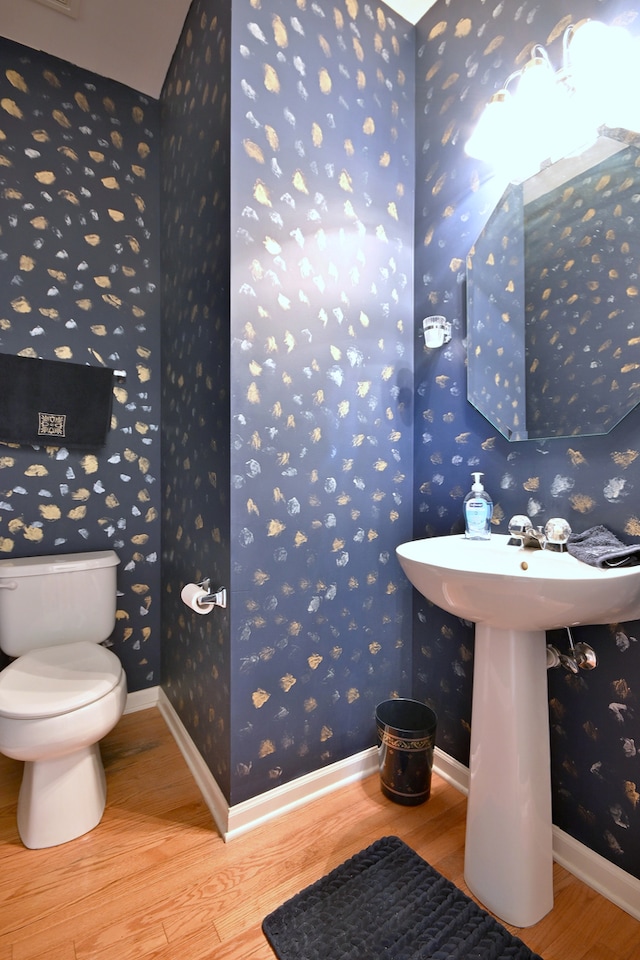 24316 W Bristol Ave, Plainfield, IL 60585 - bathroom featuring wood finished floors, wallpapered walls, toilet, and baseboards