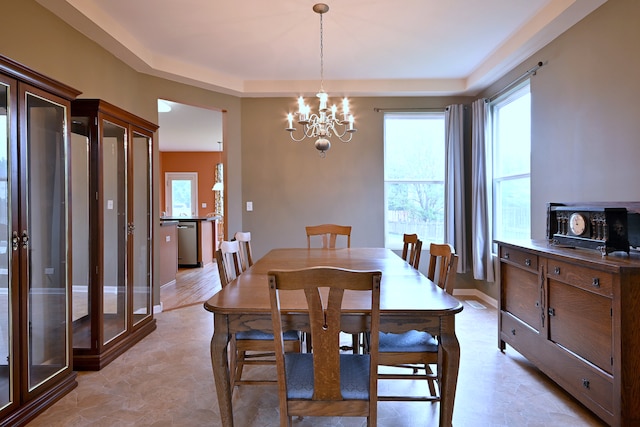 24316 W Bristol Ave, Plainfield, IL 60585 - dining space with a chandelier, a tray ceiling, and baseboards