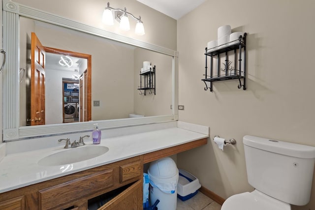 57 Huntcliff Ct, Fox River Grove, IL 60021 - half bathroom featuring toilet, washer / dryer, vanity, and tile patterned flooring