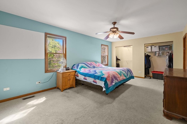 57 Huntcliff Ct, Fox River Grove, IL 60021 - bedroom featuring baseboards, multiple closets, light carpet, and ceiling fan