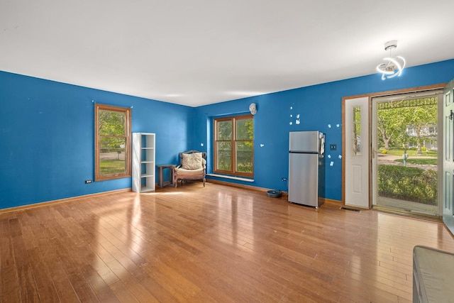 57 Huntcliff Ct, Fox River Grove, IL 60021 - unfurnished room with healthy amount of natural light, wood-type flooring, and baseboards