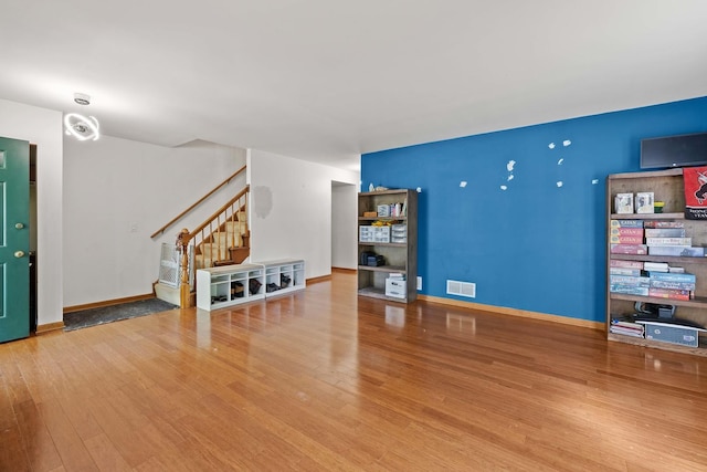 57 Huntcliff Ct, Fox River Grove, IL 60021 - unfurnished living room featuring stairway, wood finished floors, and baseboards